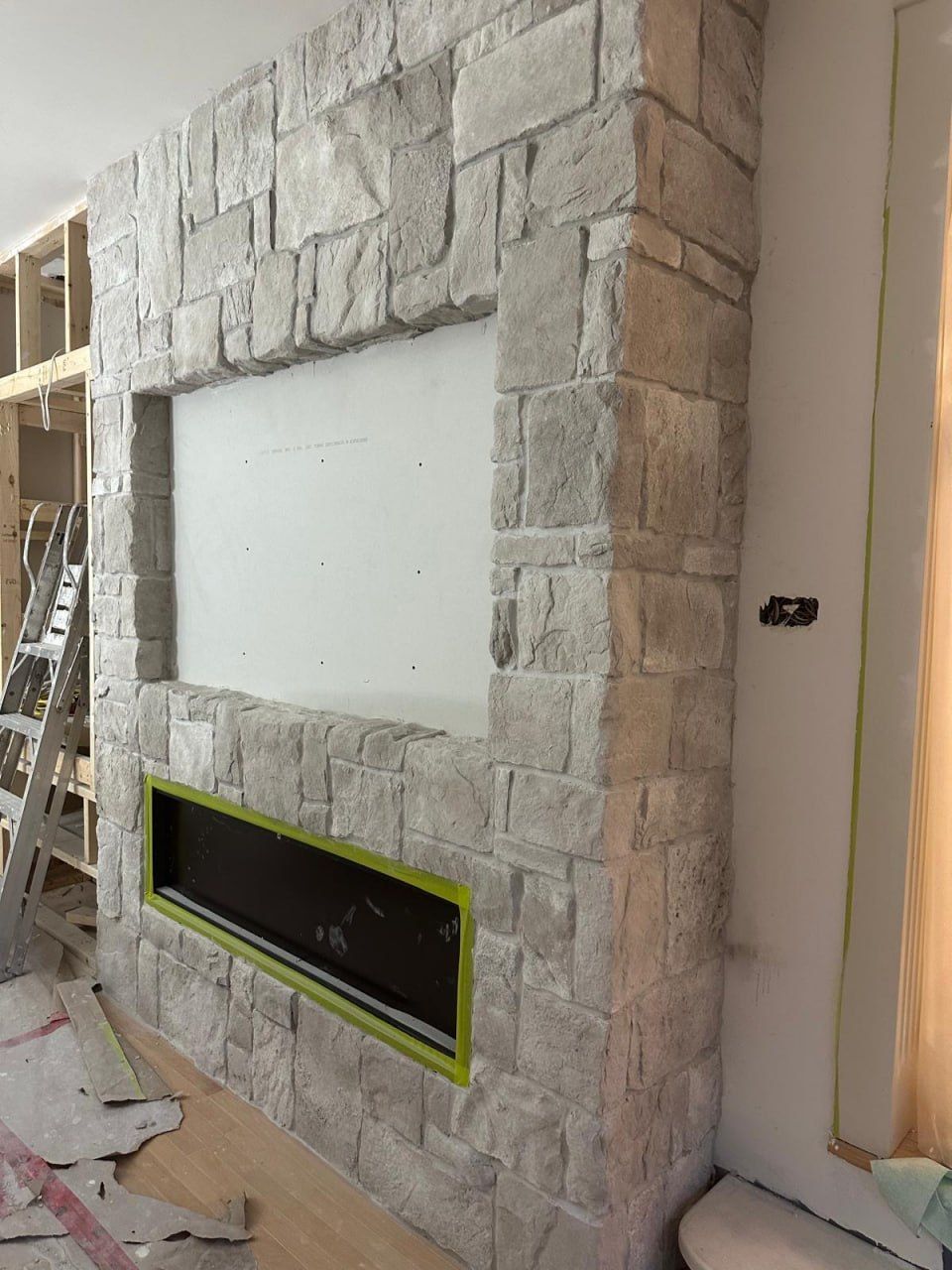 Natural stone fireplace under construction