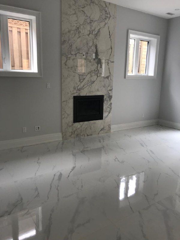 Marble fireplace with polished marble-look floor