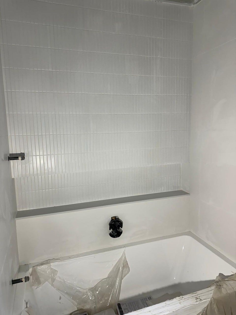 Kit-kat tile tub surround protected during installation