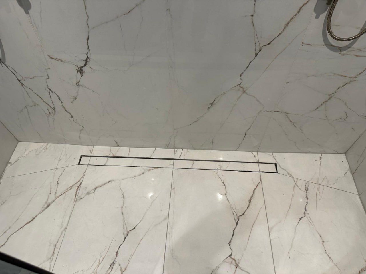 Marble shower floor with hidden linear drain