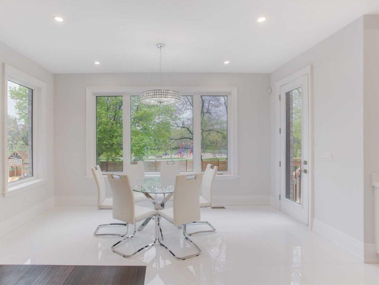 Dining room with high-gloss white porcelain floor